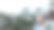 一个夏季城市的背景，有不同的房子和树木被群山包围图片下载