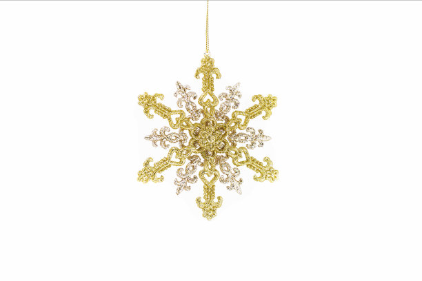 雪花。在白色的雪花。古老的金色圣诞雪花孤立地挂在白色的背景上。金色圣诞闪闪发光。图片下载
