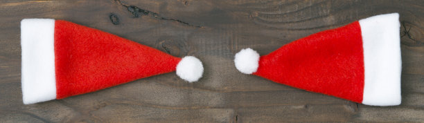 木制背景上的圣诞老人帽，网络横幅图片下载