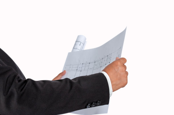 商人手中有建筑平面图或建筑平面图，用于相关专业的房屋交易、房地产、建筑。图片下载