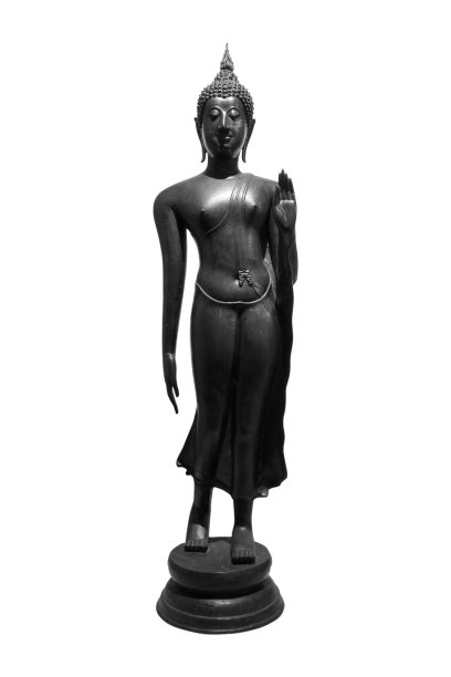 佛教的佛像孤零零地立在白色背景的小路上。图片下载