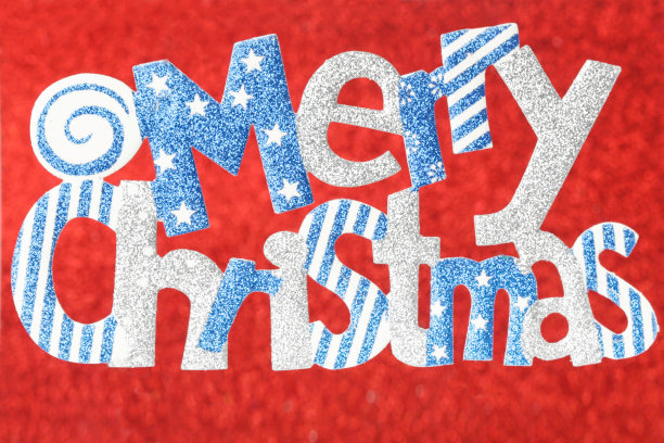 在喜庆的红色背景上闪烁着圣诞快乐的文字图片下载