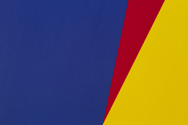 抽象蓝、红、黄三色纸几何构图背景图片下载