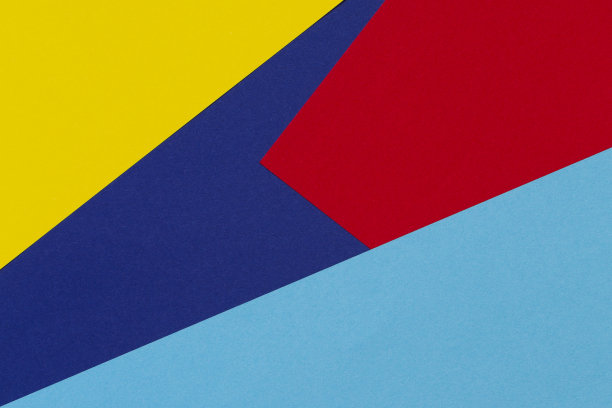 抽象蓝、红、黄三色纸几何构图背景图片下载