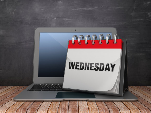 周三日历与电脑笔记本在黑板上的背景- 3D渲染图片下载