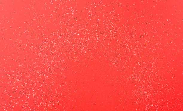闪亮的颗粒在红色的圣诞装饰背景上闪闪发光图片下载