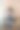 亚洲女性坐在笔记本电脑前看智能手机屏幕图片下载