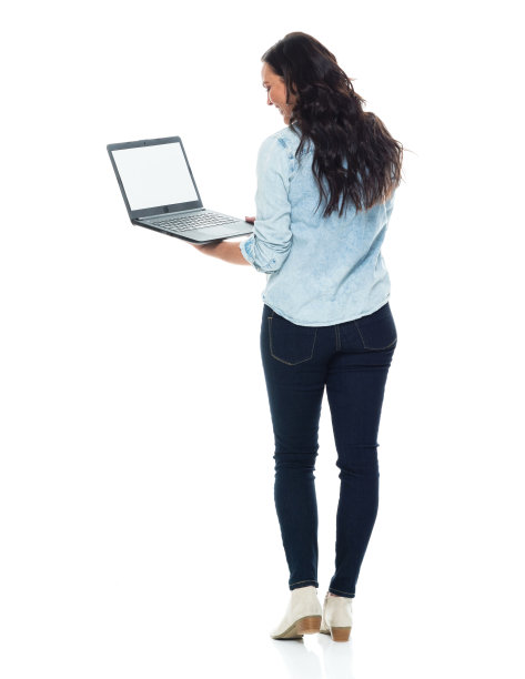 全长/后视图/后面/一个人的成年人漂亮的棕色头发/长发白种人女性/年轻女性/中年妇女/中年人站着穿衬衫/衬衫/牛仔裤/裤子谁正在学习谁在工作图片下载