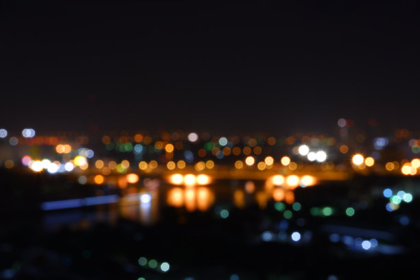 抽象模糊的圆散景灯光背景，五彩缤纷的城市夜景灯光。图片下载