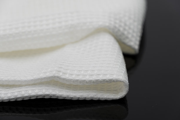 折叠的白色毛巾厨房织物的微距拍摄纹理图案图片下载