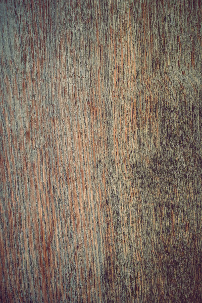 一个风化木板的特写。抽象背景的粗糙，老化的木材表面。纹理背景概念图片下载