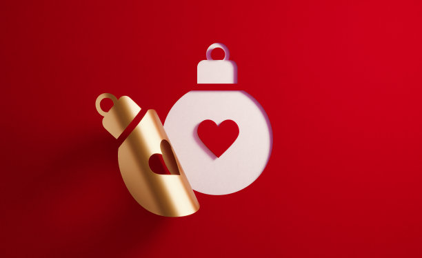 圣诞概念-心形内的一个金色折叠小玩意形状在红色的背景图片下载