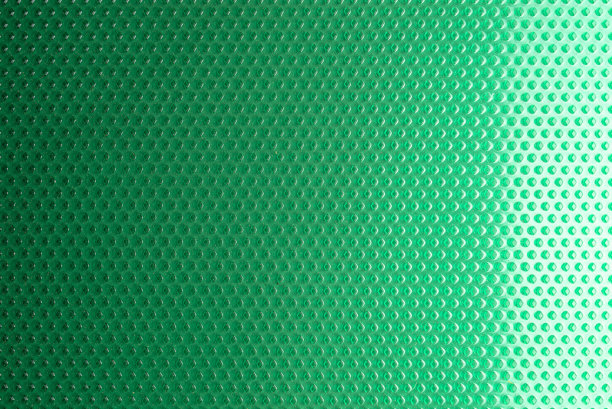 真实纹理由绿色橡胶制成的菱形近景，用灯光照亮。图片下载