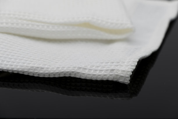 折叠的白色毛巾厨房织物的微距拍摄纹理图案图片下载