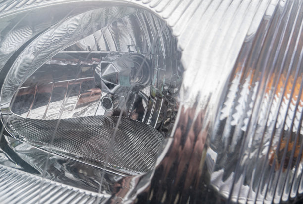 汽车前灯的背景图像。图片下载