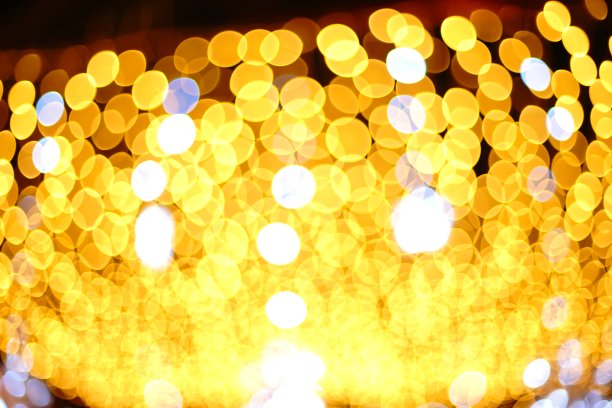 抽象模糊发光的黄色背景与双曝光散焦光图片下载