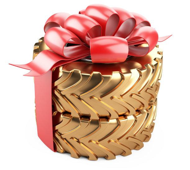 金色大轮胎，红色蝴蝶结和丝带。重型机械车辆。图片下载