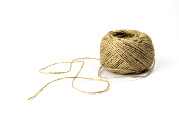 一束孤立在白色背景上的黄麻麻线图片下载