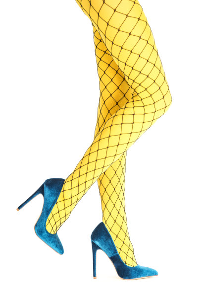 漂亮的腿在性感的网眼长袜和细高跟鞋图片下载