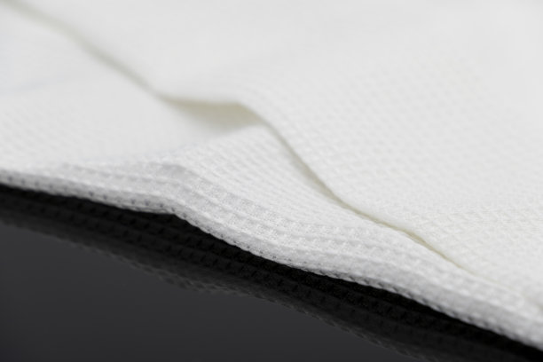 折叠的白色毛巾厨房织物的微距拍摄纹理图案图片下载