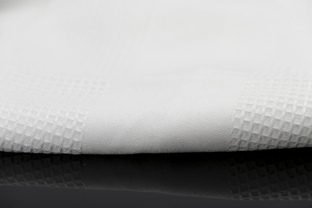 折叠的白色毛巾厨房织物的微距拍摄纹理图案图片下载