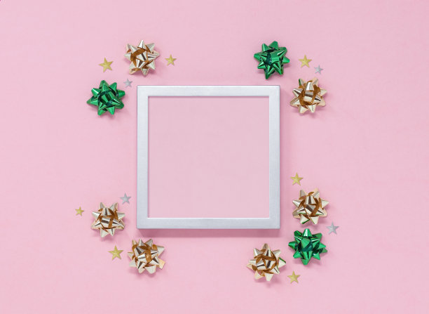 圣诞派对模型与框架，蝴蝶结和星星在一个粉红色的背景图片下载