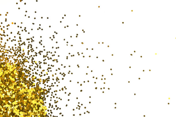 金色在白色的背景上闪闪发光。庆祝的背景。金色的五彩纸屑。图片下载