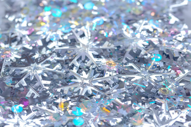 抽象的彩色圣诞背景的雪花和闪光，具有浅的景深。图片下载