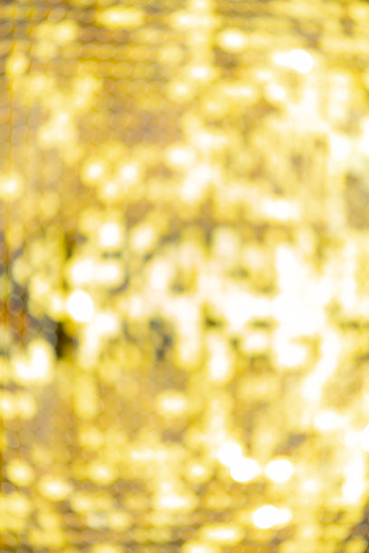 抽象模糊亮片连衣裙色彩斑斓的散景金色灯光。设计背景。迪斯科颜色图片下载
