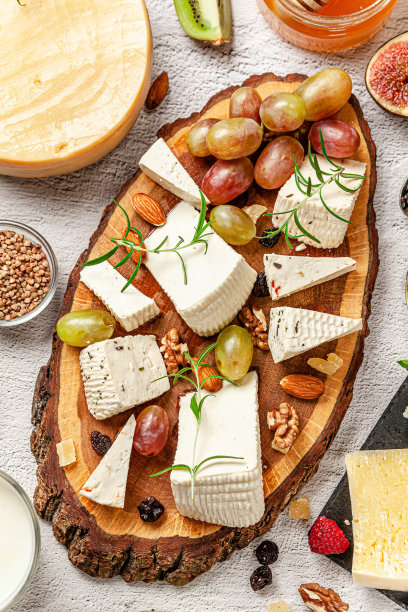 生态产品的概念。有机农场乳制品，奶酪，谷物和葡萄酒。帕尔玛干酪，羊乳酪，山羊奶酪，红酒。的背景图片。副本的空间。图片下载