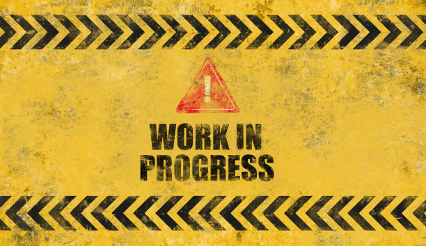 黄色预警信号。正在建设的背景。图片下载