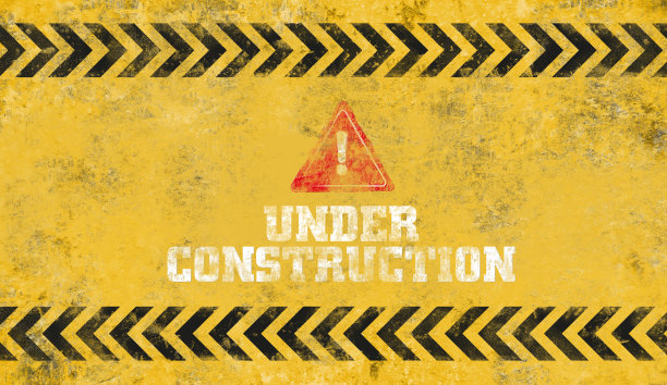黄色预警信号。正在建设的背景。图片下载