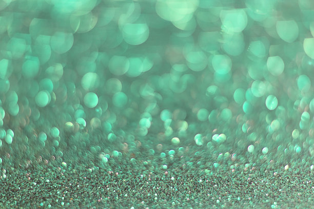 抽象背景与散焦，彩色背景与散焦闪光效果。绿色的颜色。圣诞节或新年的概念。图片下载