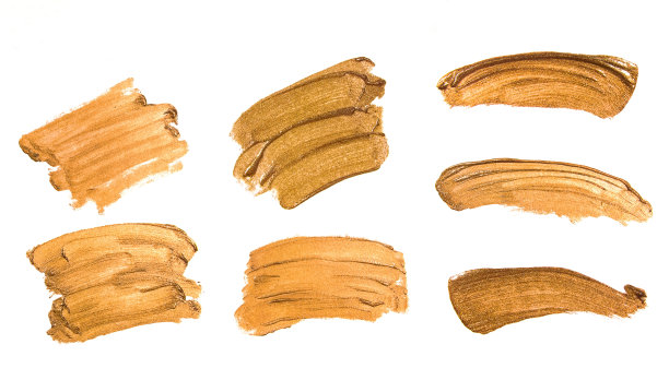 一组金色的污迹，飞溅和笔触。图片下载