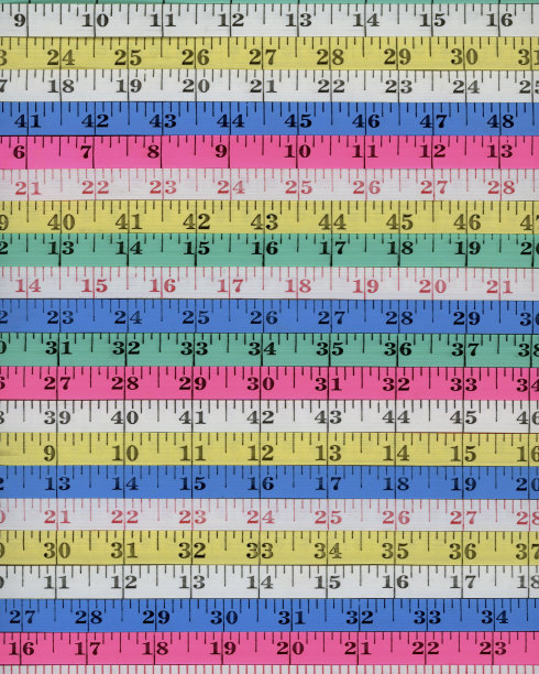 用尺子或卷尺测量背景的英寸图片下载