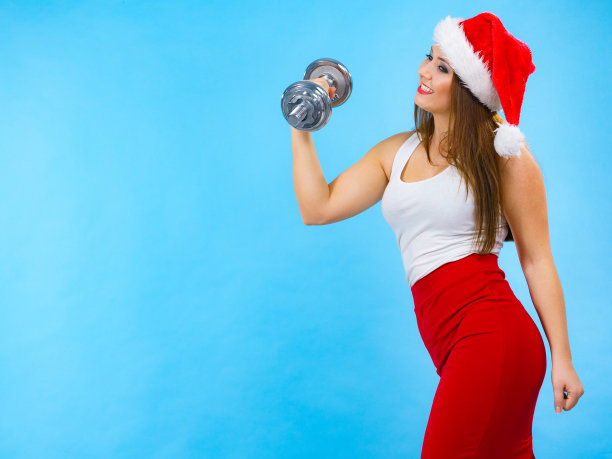 圣诞老人女人举着哑铃图片下载