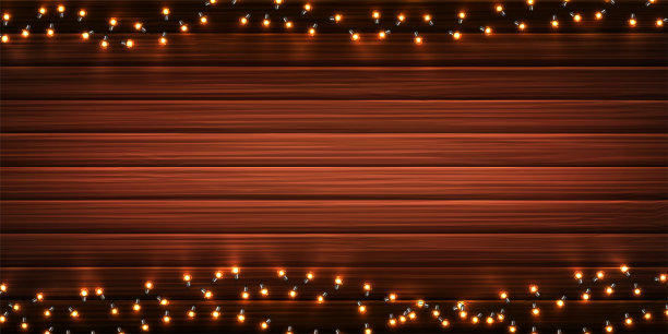 圣诞灯。圣诞发光的LED灯泡在木制纹理的背景花环。节日装饰逼真的彩色灯新年贺卡或海报。图片下载