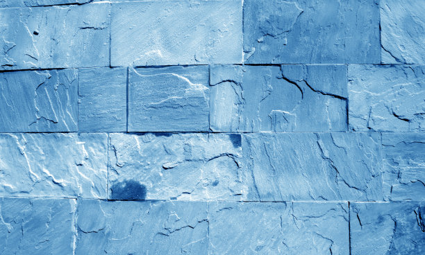 海军蓝色调的沙石墙。图片下载