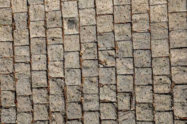 特写的铺装石纹理。俯视图照片的鹅卵石模式在街道上图片下载