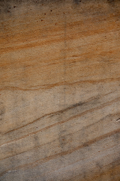 棕色砂岩墙体纹理细节。特写照片的砂砾背景。水平方向图片下载