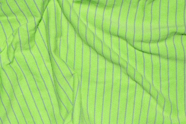 带有灰色条纹的绿色织物。图片下载