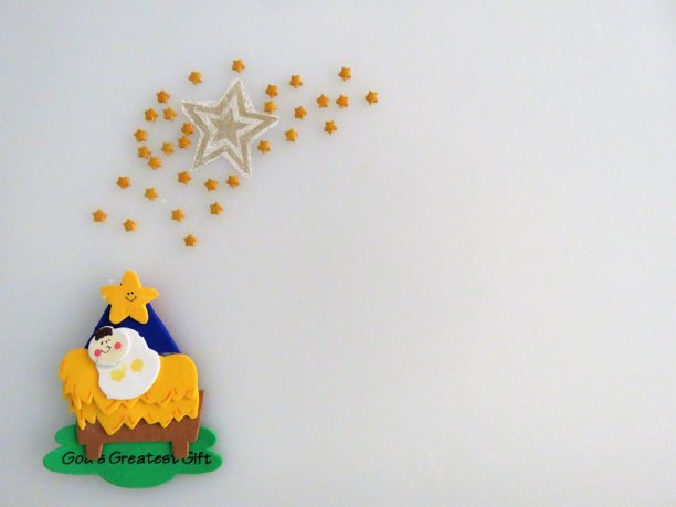 耶稣诞生-婴儿耶稣在婴儿床，星星，复制空间，背景图片下载