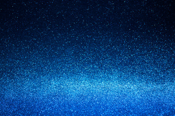 海军蓝抽象灯光背景，深蓝色的散景灯光，闪闪发光的圣诞彩灯。季节的问候背景。新年奢侈品背景图像。模糊抽象的假日背景。图片下载