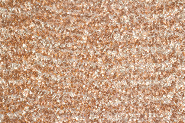 抽象节日背景与圆形亮片与色彩过渡。铜色和米色。图片下载