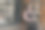 一位女时装模特走在现代建筑附近的城市街道上图片下载