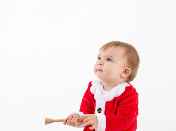 一个白色背景的婴儿装扮成圣诞老人的照片图片下载
