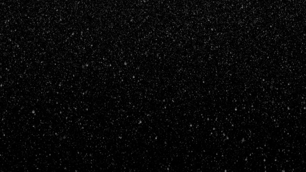 在黑暗的夜晚，雪或雨从天空中落下。图片下载
