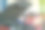 亚洲汽车技师与红衬衫使用电子工具和笔记本电脑检查汽车发动机的部分在车库引擎盖附近图片下载