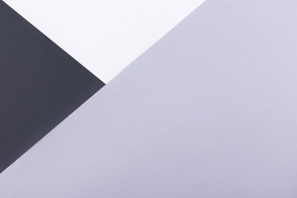 用黑色和灰色的纸做最小的背景。平的。图片下载