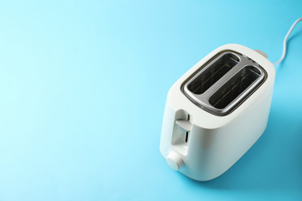 面包烤面包机的蓝色背景，文字空间图片下载